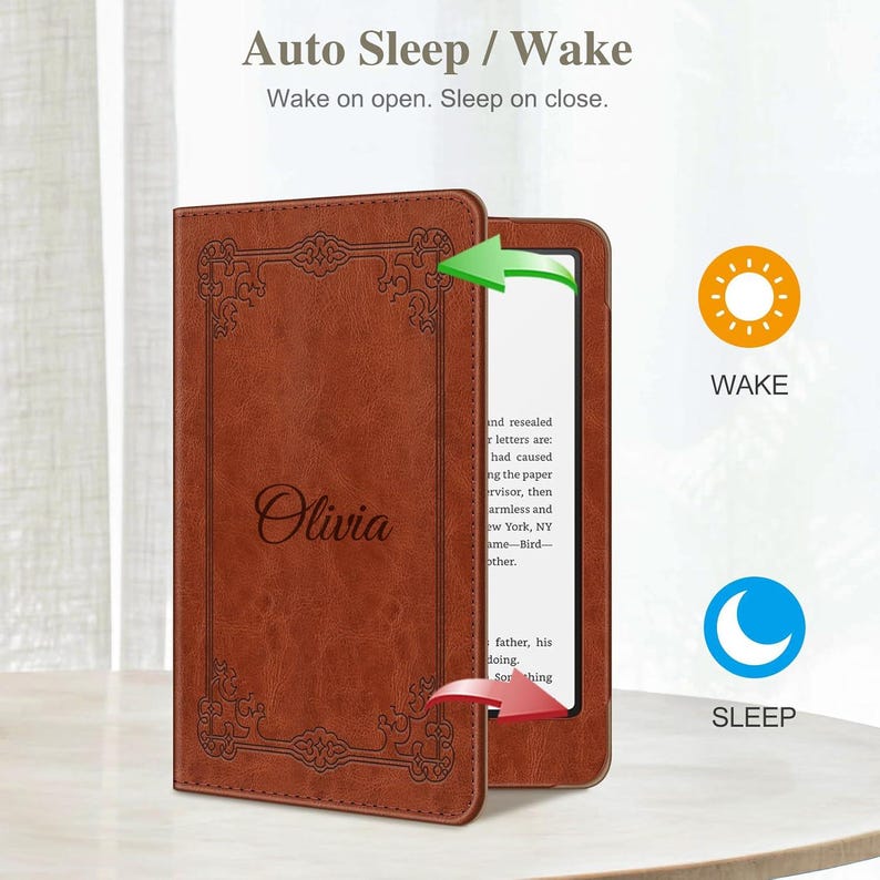 May include: A brown leather-like e-reader case featuring the name Olivia engraved on the front cover with a decorative border. The case includes an auto sleep and wake function, indicated by text and icons showing the device waking upon opening.