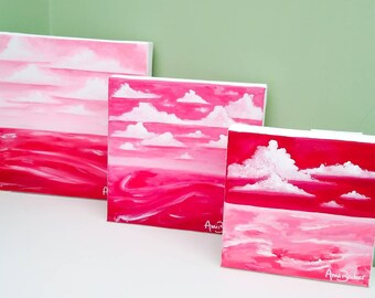 Original paintings - trio of red & pink seascape paintings on canvas in different sizes. Square box canvas. Wall art by Ami Becker Art