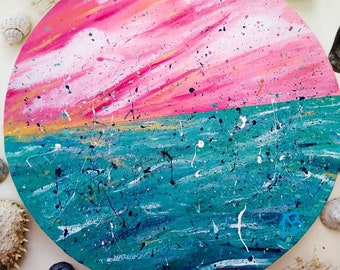 Seascape painting on round circle canvas. Red pink sky & green blue sea. Acrylic on canvas. Clouds, sea, vibrant, splash, wall art, artist.