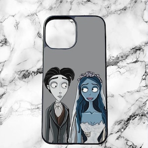 May include: A black phone case featuring a gray background with a cartoon illustration of a bride and groom. The bride has blue skin and a white wedding dress. The groom is wearing a black suit and brown vest.