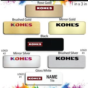 May include: A variety of name badge designs for Kohl's employees. The badges are available in different colors and finishes, including rose gold, brushed gold, mirror gold, black, mirror silver, brushed silver, and gloss white. Each badge features the Kohl's logo and space for a name and title. The badges are 1 inch by 3 inches.