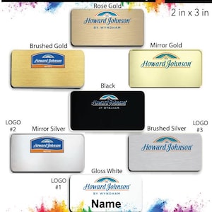 May include: A collection of name badges for a Howard Johnson hotel. The badges are available in different colors and finishes, including rose gold, brushed gold, mirror gold, black, mirror silver, brushed silver, and gloss white. The badges are 2 inches by 3 inches and come with a free pin back.