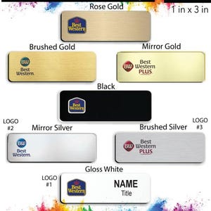 May include: A collection of Best Western hotel name badges in various colors and finishes, including rose gold, brushed gold, mirror gold, black, mirror silver, brushed silver, and gloss white. The badges are 1 inch by 3 inches and feature the Best Western logo. The badges are available with a free pin back.