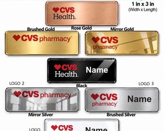 May include: A collection of rectangular CVS name badges measuring 1 inch by 3 inches. The badges feature various finishes including rose gold, brushed gold, mirror gold, black, mirror silver, brushed silver, and gloss white with CVS logos.