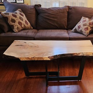 Live edge maple coffee table with black metal legs