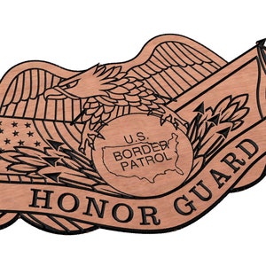 May include: A wooden plaque with a brown background and black lettering. The plaque features an eagle with wings spread, a globe with the United States outlined, and a banner that reads "U.S. BORDER PATROL HONOR GUARD".