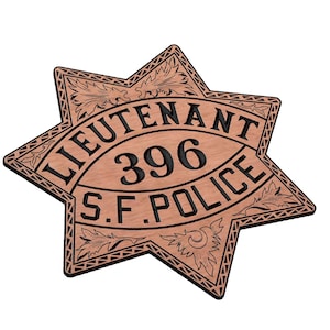 May include: A wooden, six-pointed star-shaped badge with the text "LIEUTENANT 396 S.F. POLICE" in black. The badge has an ornate, engraved border and decorative elements. The background is white.