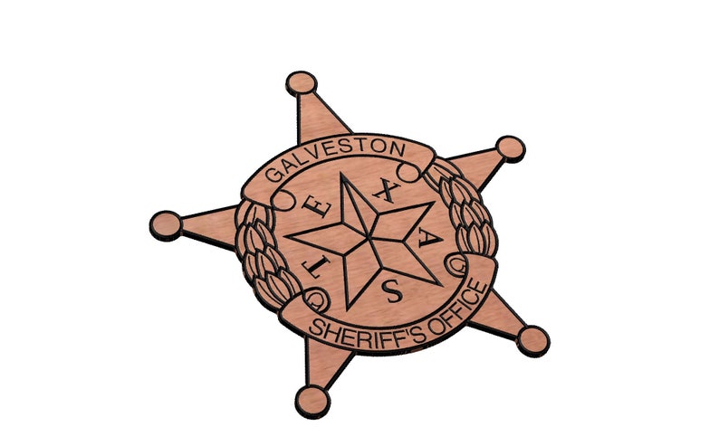 May include: A wooden sheriff's badge with a five-pointed star and the words "GALVESTON SHERIFF'S OFFICE" around the star.