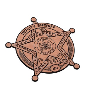 May include: A wooden sheriff's star badge with the text "DEPUTY SHERIFF FREDERICK COUNTY MD" and the state seal of Maryland.