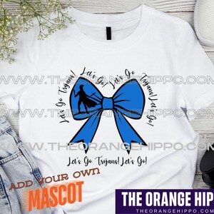 May include: White t-shirt with a blue bow and the text "Let's Go Trojans! Let's Go!"  Add your own mascot.