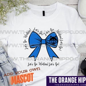 May include: White t-shirt with a blue bow and the text "Let's Go Wolves! Let's Go!"  Add your own mascot.