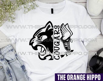 May include: White t-shirt featuring a black and white graphic of a cougar's head and the word "COUGARS" in a vertical font. The design also includes a winged sword. The Orange Hippo logo is at the bottom.