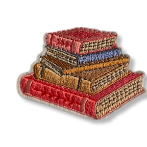 May include: Embroidered patch depicting a pile of books in red, brown, and blue hues. The books are intricately stitched, showing pages and textured covers. The patch has a white border, ideal for application on garments or accessories.