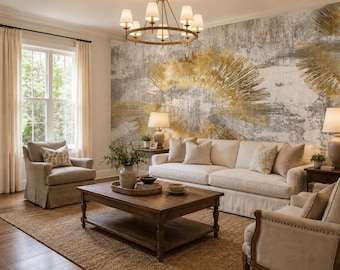 May include: A living room featuring a large wall mural with abstract gold and gray brushstrokes, a cream-colored sofa, two beige armchairs, a wooden coffee table, a round chandelier with multiple lights, and light-colored curtains by the window.