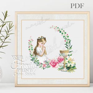 May include: Cross stitch pattern featuring a girl in a white dress holding a chalice, surrounded by flowers and greenery. The pattern is titled "mariska".