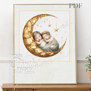 May include: Two babies sleeping on a golden crescent moon with stars. The babies are wearing white and blue clothing and have their arms around each other. The moon is decorated with gold leaves.