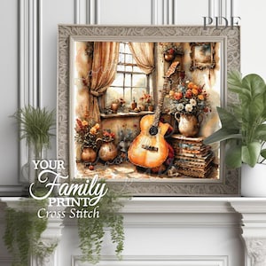Puede incluir: Una obra de arte de punto de cruz enmarcada representa una escena interior acogedora. Una guitarra se apoya en una ventana con cortinas, y un jarrón de flores se encuentra sobre una pila de libros. Incluye el texto "YOUR Family PRINT Cross Stitch".