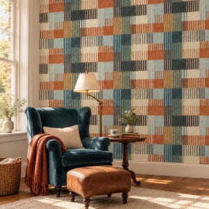 May include: Wallpaper featuring a geometric grid pattern of vertical stripes in shades of rust orange, teal, dark blue, and cream. The design creates a woven effect across the wall surface, providing a structured and colorful backdrop for the room.