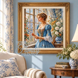 Puede incluir: Una pintura de diamantes enmarcada que muestra a una persona con un vestido azul junto a una ventana con un arreglo floral. La obra tiene una textura de cuadrícula y está en un marco dorado. El texto YOUR FAMILY PRINT aparece sobre la imagen.