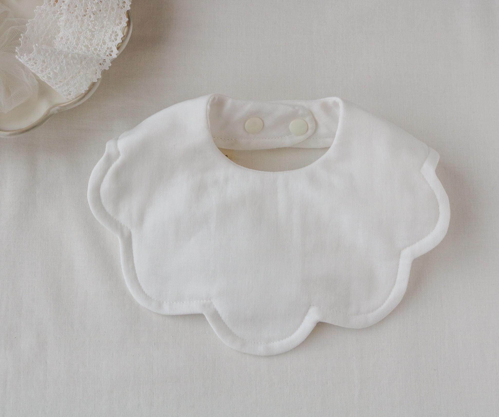 Pastel colour scalloped bib with topstitching