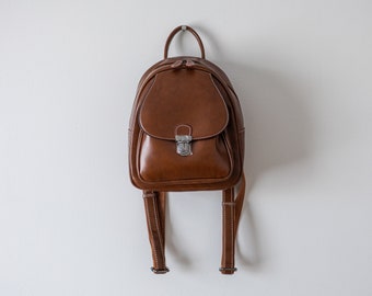 Genuine leather, Brown Mini backpack purse, multiple pockets, adjustable straps, carry on, Vacation, Spring Break.