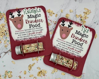 May include: Two red and white Christmas cards with reindeer illustrations and the text "Raleigh's Magic Reindeer Food" and "Tys Magic Reindeer Food".  Directions are included on each card: "Sprinkle this reindeer food outside tonight, the moonlight will make it sparkle bright. As the reindeer fly and roam, this will guide them to your home."