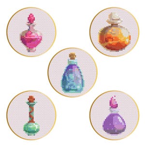 May include: Five round embroidery hoops with different colored potion bottles inside. The bottles are pink, orange, blue, green, and purple.