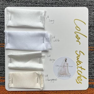 Pode incluir: Um cartão branco exibe amostras de cores de tecido rotuladas como Marfim, Branco, Bege e Champanhe. O cartão inclui o texto "Color Swatches" e um logotipo da Marry You Design. As amostras são presas ao cartão.