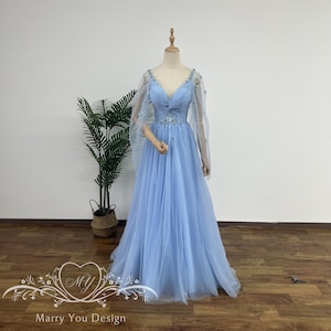 dress with fairy lights This glowing fairy dress lights up and has pretty wings that look like magic! Its perfect for cosplay and Comic Con adventures. Youll feel like a real fairy flying through the crowd, spreading