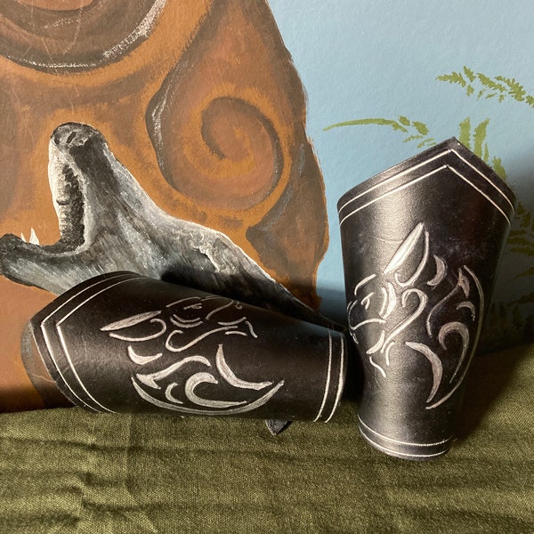 Leather Armour.  Matched Pair of Black Bracers with embossed and silver wolf design.