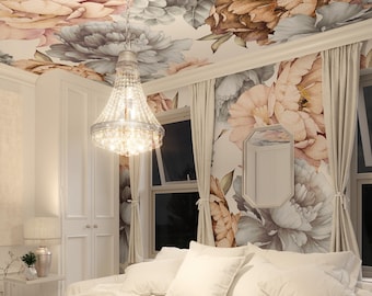 May include: A bedroom with a floral ceiling and wall mural in peach, grey, and brown tones. A crystal chandelier hangs from the ceiling, illuminating a white bed with pillows. The room has white curtains and a white door.