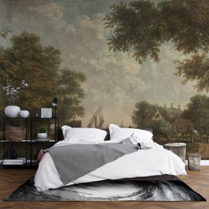 May include: A bedroom with a landscape mural, a bed with white linens and a gray throw blanket, and a black and white rug. A black metal shelf holds decor and plants. The room has a vintage aesthetic.