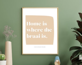May include: A beige and white printable wall art print with the text "Home is where the braai is." and the words "South African Proverb" at the bottom.