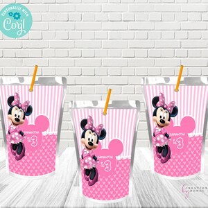 May include: Three clear plastic pouches with pink and white striped backgrounds, featuring Minnie Mouse illustrations. Each pouch has a pink Minnie Mouse head shape, the text "Samantha is 3", and a yellow straw. The pouches are designed for a birthday party.