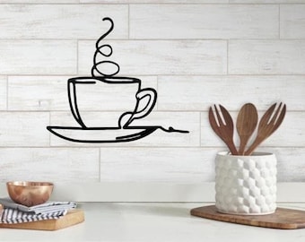 May include: Black metal wall art featuring a stylised coffee cup with steam rising from it. The cup is on a saucer and the design is minimalist.