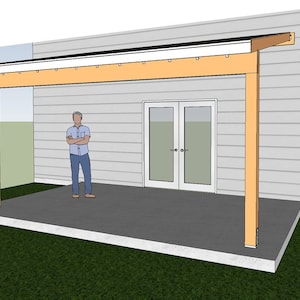 May include: A wooden patio cover with a white roof and light-colored support beams. The structure is attached to a light gray building with double doors. A person stands on the concrete patio.