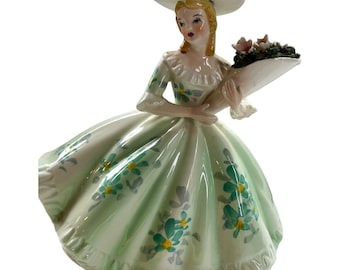 Lefton japan figurine Lady green dress holding roses has Lefton sticker