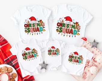 May include: White t-shirts and a onesie with a colorful Christmas Squad design. Each shirt features a Santa hat, candy canes, and Christmas lights. The shirts are for Mommy, Daddy, Alex, Harry, and Sarah.