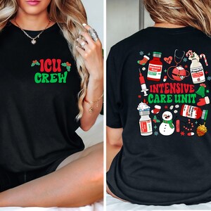 May include: Black t-shirt with "ICU CREW" in green and red on the front. The back features a festive design with medical supplies, a snowman, and the words "INTENSIVE CARE UNIT" in green and red, perfect for healthcare workers.