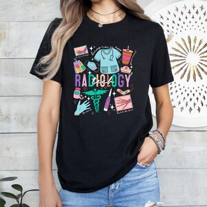 May include: Black t-shirt with a colorful graphic design featuring a stethoscope, a medical mask, a bandage, a syringe, and the text "Tech Radiology".