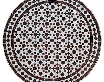May include: Round table top with a brown and white geometric mosaic tile design. The tile pattern features a repeating star and diamond shape. The table top is approximately 30 inches in diameter.
