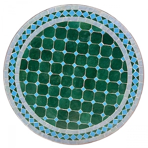 May include: Round green and blue mosaic tile tabletop. The center of the table is green with a geometric pattern of smaller blue squares. The outer edge of the table is a border of alternating blue and white diamond shapes.