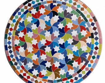 May include: A round mosaic table top with a colorful starburst design. The table features a white background with a pattern of multi-colored star shapes in shades of blue, red, orange, green, and brown. The border is a mix of geometric shapes and colors.