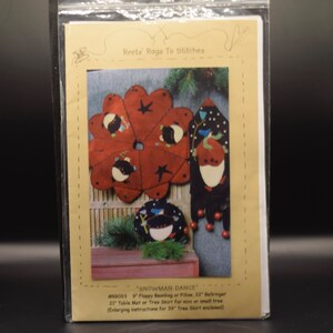 May include: A pattern for a snowman-themed beanbag or pillow, table mat, or tree skirt. The pattern includes instructions for a 22-inch bellringer, a 21-inch table mat or tree skirt, and a 39-inch tree skirt. The pattern is called "Snowman Dance" and is by Reets Rags To Stitches.