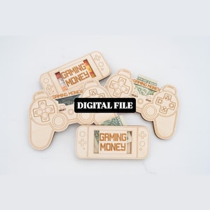 May include: Wooden game controller and handheld console-shaped money holders. Each holder has the words "GAMING MONEY" printed on it. The words "DIGITAL FILE" are printed on a black rectangle.