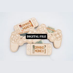 May include: Wooden game controller and handheld console-shaped money holders. Each holder has the words "GAMING MONEY" printed on it. The words "DIGITAL FILE" are printed on a black rectangle.