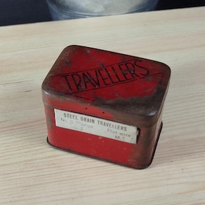 Vintage still grain travelers worn red tin from the 50s