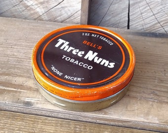 Vintage Bell's Three Nuns tobacco round tin from the 60s