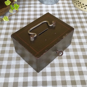 Vintage small metal cash box, old piggy bank with key