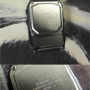 May include: The back of a silver Casio watch with the text "CASIO 676 DBC-62 STAINLESS STEEL BACK JAPAN T" engraved on it.